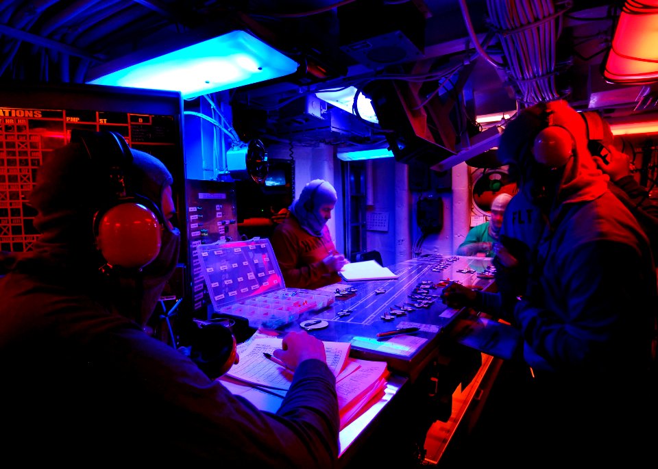 US Navy 070409-N-3729H-012 Sailors manning Flight Deck Control relay messages throughout the ship about the status of the flight deck during a general quarters drill aboard the Nimitz-class aircraft carrier USS John C. Stennis