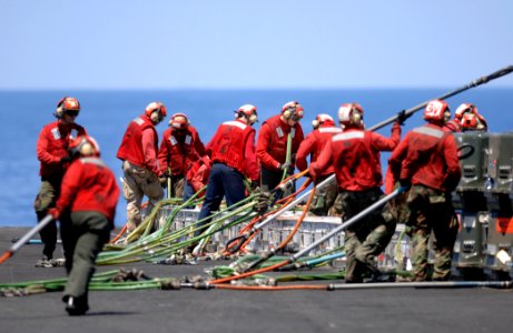 US Navy 070406-N-5961C-005 Sailors from USS Ronald Reagan's Weapons Department prepare the ship's ammunition that will be flown off during a weapons offload