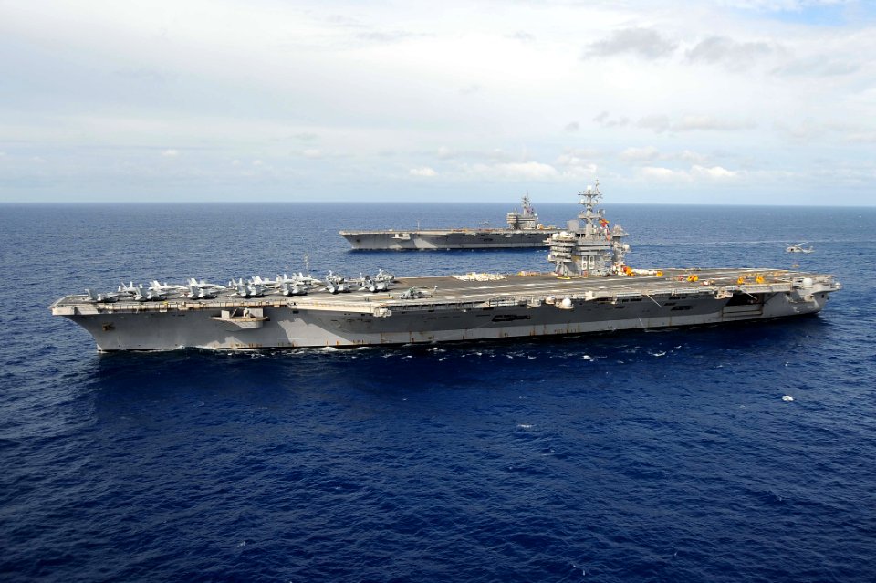 USS Dwight D. Eisenhower participates in an ammunition on-load with USS George H. W. Bush. (7017609481)