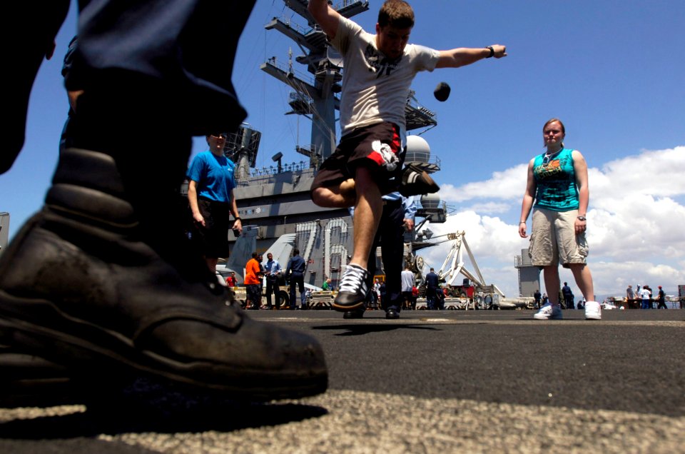 US Navy 070409-N-7130B-079 During a steel beach picnic on the flight deck of USS Ronald Reagan (CVN 76), Sailors relax by kicking around a hacky-sack