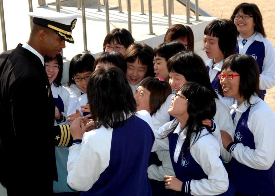 US Navy 070406-N-6710M-053 The Commanding Officer of amphibious dock landing ship USS Tortuga (LSD 46) greets students from the Dongjin Girls Middle School in Jinhae City