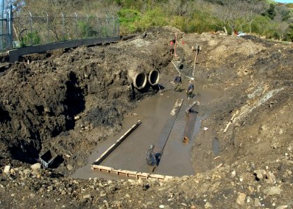 US Navy 070405-N-5253W-003 Seabees assigned to Naval Mobile Construction Battalion (NMCB) 3 lay the foundations for a wall at the Ikego Housing Complex