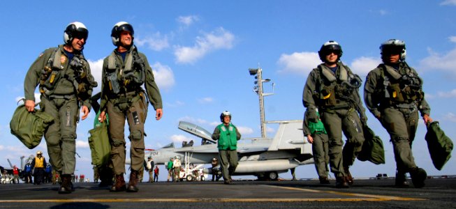 US Navy 070410-N-5345W-107 Carrier Strike Group Ten (CSG 10) Chief of Staff, Capt. Michael Ullrich, far left, shares a laugh with his pilot