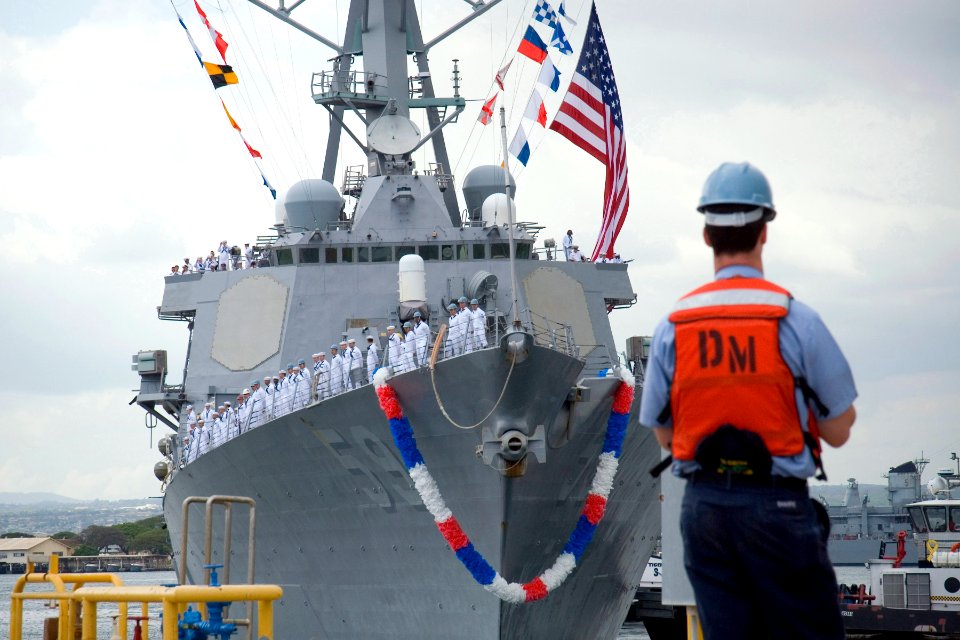 US Navy 070407-N-4856G-024 A Sailor stands ready to receive the lines from the guided missile destroyer USS Russell (DDG 59) as the ship returns to Naval Station Pearl Harbor from a three-month deployment