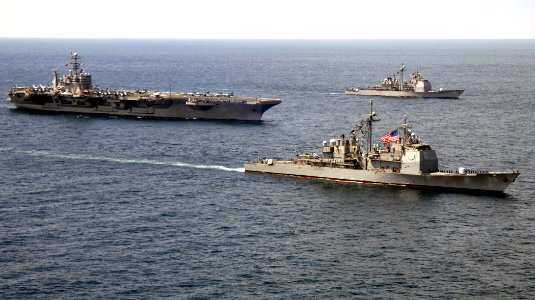 US Navy 070406-N-0535P-049 Ticonderoga-class guided missile cruisers USS San Jacinto (CG 56) and USS Hue City (CG 66) transit alongside USS Harry S. Truman (CVN 75)