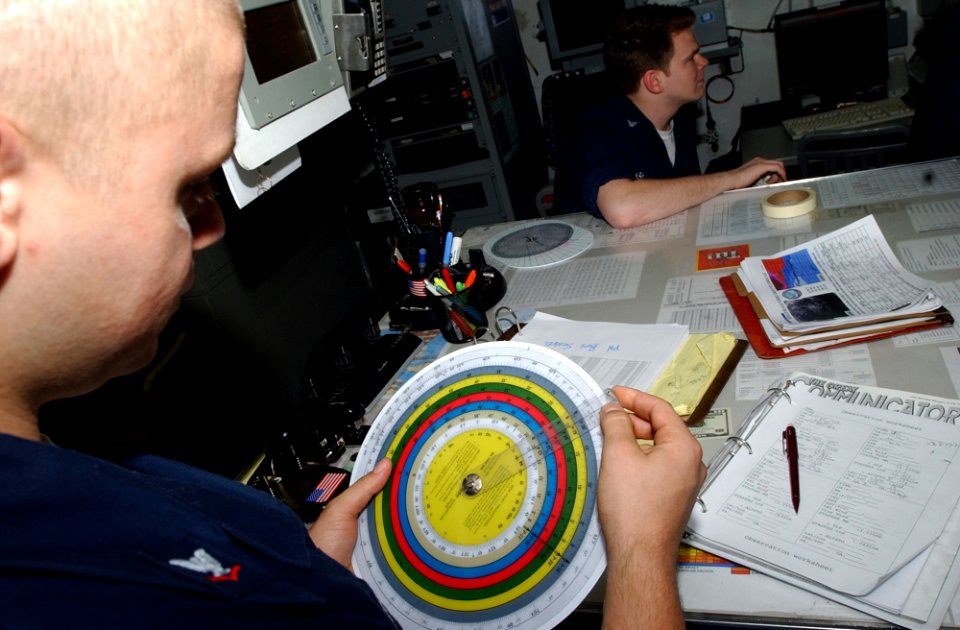 US Navy 070406-N-4009P-186 Aerographer's Mate 3rd Class Heath Collins, from Kirbyville, Texas, uses a psychometric calculator to determine the dew point and relative humidity for the current location of Nimitz-class aircr