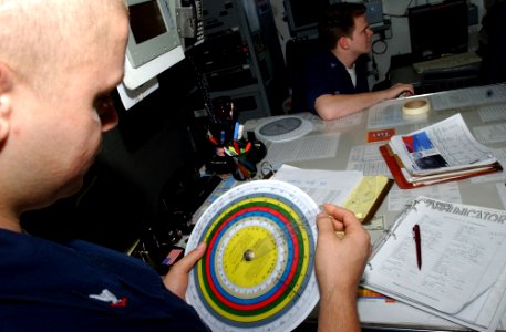 US Navy 070406-N-4009P-186 Aerographer's Mate 3rd Class Heath Collins, from Kirbyville, Texas, uses a psychometric calculator to determine the dew point and relative humidity for the current location of Nimitz-class aircr