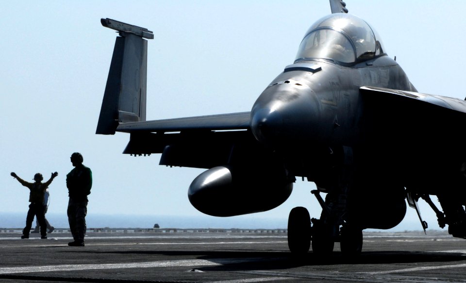 US Navy 070406-N-2659P-043 An F-A-18F Super Hornet, from the Black Knights of Strike Fighter Squadron (VFA) 154, taxis down the runway after landing aboard Nimitz-class aircraft carrier USS John C. Stennis (CVN 74)