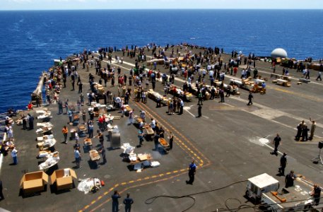 US Navy 070409-N-4009P-393 Sailors take part in a steel beach picnic on the flight deck aboard the Nimitz-class aircraft carrier USS Ronald Reagan (CVN 76) photo