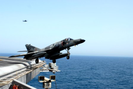 US Navy 070412-N-8157C-307 A French Super-Etendard from the nuclear-powered aircraft carrier French Navy Ship Charles de Gaulle (R 91) completes a touch-and-go on the flight deck of the Nimitz-class aircraft carrier USS John C