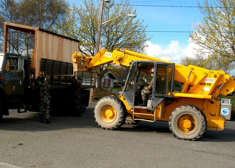 US Navy 070410-N-6247M-001 Seabees unload one of the four baseball dugouts built for the North Whidbey Little League. Seabees volunteered their expertise and labor to build the structures as part of their involvement with the l