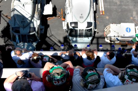 US Navy 070414-N-1635S-005 Looking out from Vulture's Row above the flight deck of USS Ronald Reagan (CVN 76), family and friends of Sailors await the start of an air power demonstration conducted by Carrier Air Wing (CVW) 14