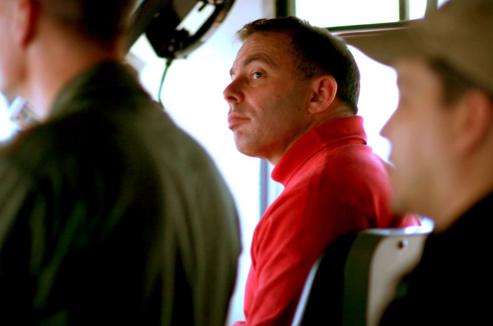 US Navy 070406-N-7130B-103 On the bridge of the aircraft carrier USS Ronald Reagan (CVN 76), Commanding Officer, Capt. Terry B. Kraft monitors the progress of an ammunition offload