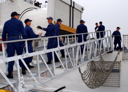 US Navy 070409-N-8544C-008 Coast Guardsmen assigned to the Coast Guard Cutter Northland (WMEC 904), offload 2,400 pounds of cocaine and four bales of marijuana seized off the coast of Columbia March 10, 2007