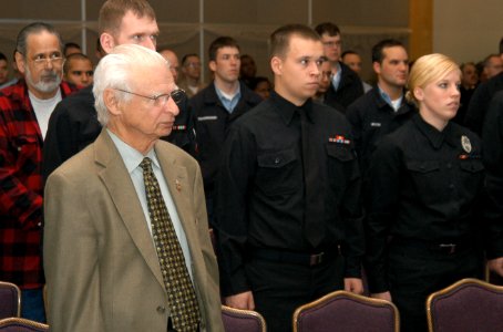 US Navy 070412-N-3390M-001 Holocaust survivor Fred Taucher stands during the National Anthem at a Holocaust Remembrance Day program