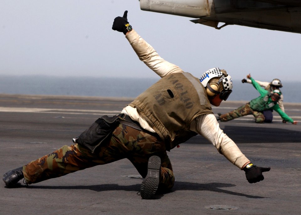 US Navy 070410-N-6854D-001 Troubleshooters assigned to the Patriots of Electronic Attack Squadron (VAQ) 140 give a ready-to-go sign