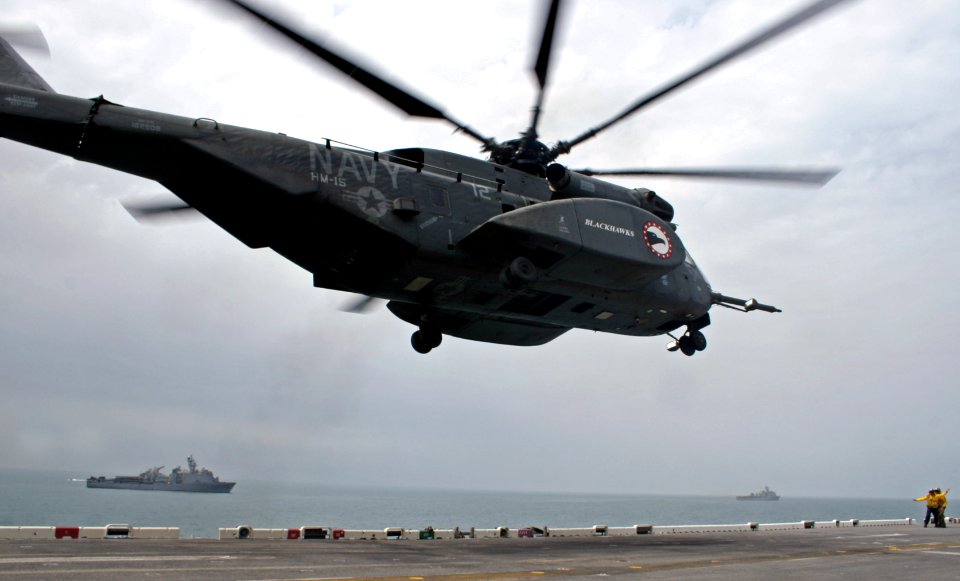 US Navy 070412-N-1328S-008 An MH-53E Sea Dragon helicopter departs USS Boxer (LHD 4) to deliver supplies to ships in the strike group