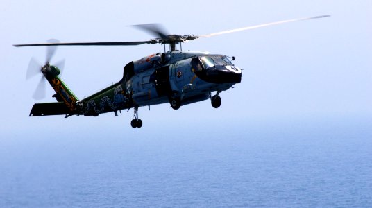 US Navy 070413-N-3038W-474 An SH-60F Seahawk, from the Eightballers of Helicopter Anti-Submarine Squadron (HS) 8, flies through the air acting as plane guard for Nimitz-class aircraft carrier USS John C. Stennis (CVN 74)