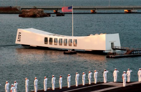 US Navy 070409-N-4009P-281 Sailors manning the rails render honors as they pass the USS Arizona Memorial while entering Pearl Harbor aboard USS Ronald Reagan (CVN 76) photo