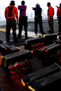 US Navy 070411-N-9928E-112 Sailors fire 9mm pistols during a small-arms live fire exercise on the flight deck of the Nimitz-class aircraft carrier USS John C. Stennis (CVN 74)