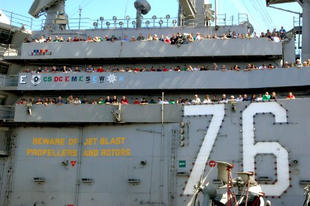 US Navy 070414-N-1635S-006 Looking out from Vulture's Row above the flight deck of USS Ronald Reagan (CVN 76), family and friends of Sailors observe an air power demonstration conducted by Carrier Air Wing (CVW) 14