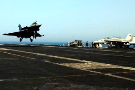 US Navy 070412-N-0684R-068 A French Rafale from the nuclear-powered aircraft carrier French Navy Ship Charles de Gaulle (R 91) performs a touch-and-go landing on the flight deck of the Nimitz-class aircraft carrier USS John C