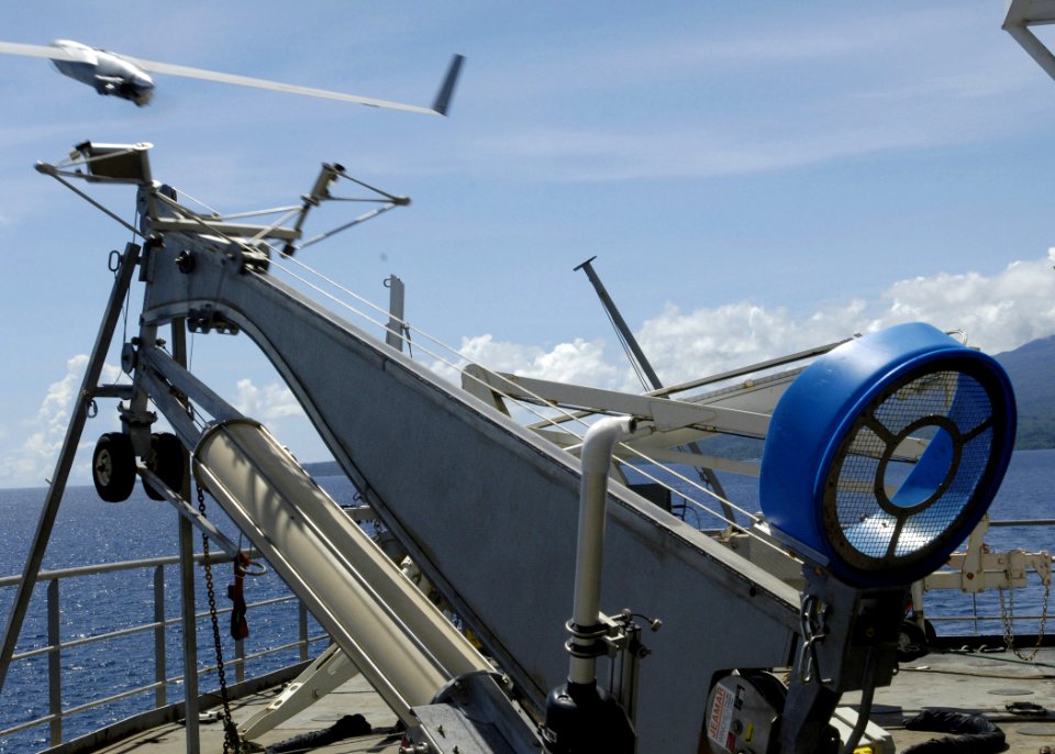 US Navy 070417-N-4790M-078 A Scan Eagle unmanned aerial vehicle is launched from USNS Stockham (T-AK 3017) to assess coastal damage to outlying islands from an April 2 earthquake and tsunami