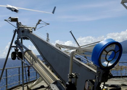 US Navy 070417-N-4790M-078 A Scan Eagle unmanned aerial vehicle is launched from USNS Stockham (T-AK 3017) to assess coastal damage to outlying islands from an April 2 earthquake and tsunami