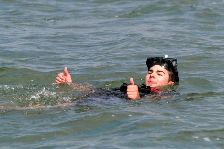 US Navy 070412-N-9604C-001 A rescue swimmer gives a thumbs-up during the annual Naval Helicopter Aviation (NHA) Symposium 2007 Aircrew Competition photo