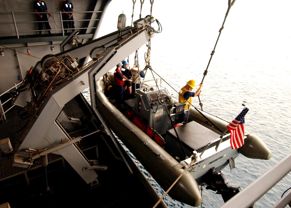 US Navy 070414-N-6854D-002 Deck department Sailors and surface rescue swimmers perform emergency boat operations during a man overboard drill aboard Nimitz-class aircraft carrier USS Dwight D. Eisenhower (CVN 69)