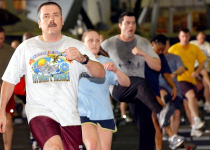 US Navy 070414-N-6854D-008 Sailors participate in a two-hour aerobics class held in the hangar bay of Nimitz-class aircraft carrier USS Dwight D. Eisenhower (CVN 69)