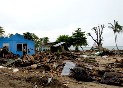 US Navy 070413-N-4790M-015 Residents try to salvage materials from houses destroyed by an earthquake and resulting tsunami