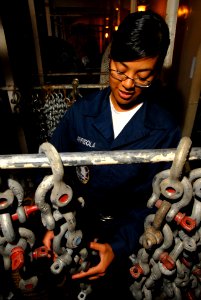 US Navy 070419-N-2659P-009 Seaman Nancy Arreola properly stows shackles in the deck office aboard Nimitz-class aircraft carrier USS John C. Stennis (CVN 74)