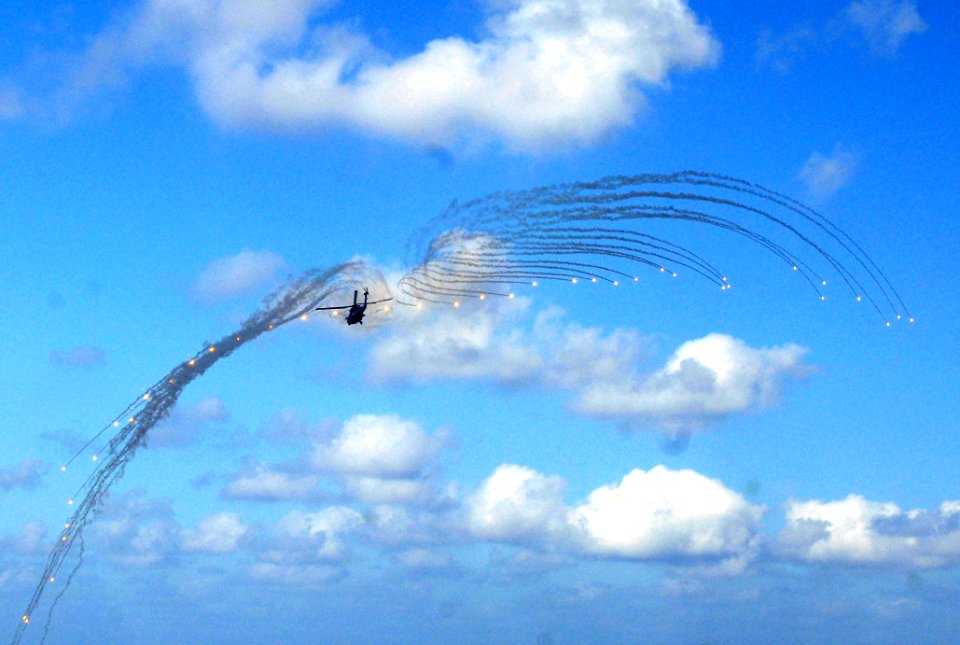 US Navy 070415-N-7730P-091 An HH-60H Seahawk, assigned to Helicopter Anti Submarine Squadron (HS) 4, shoots flares during an air power demonstration