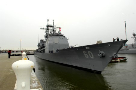 US Navy 070414-N-1713L-026 Ticonderoga-class guided missile cruiser USS Normandy (CG 60) is pulled away from the pier as she prepares to leave from Naval Station Norfolk for a scheduled deployment
