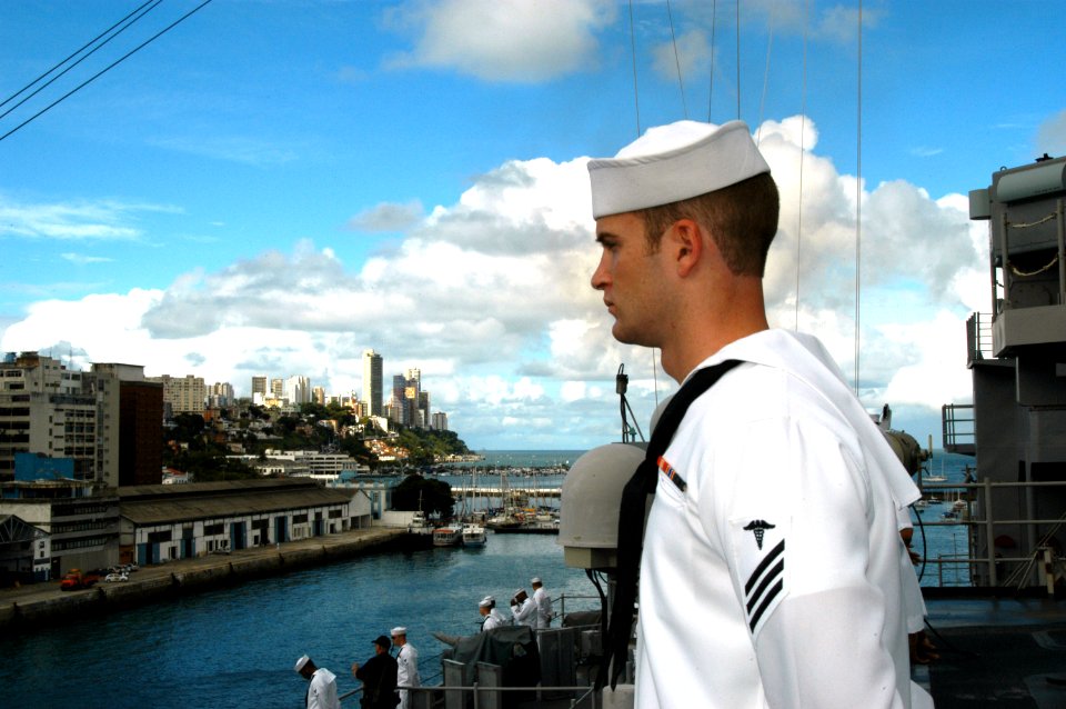 US Navy 070419-N-7029R-034 Hospital Corpsman Joshua Parrish assigned to the dock landing ship USS (LSD 52), mans the rails as the ship pulls into Salvador, Brazil