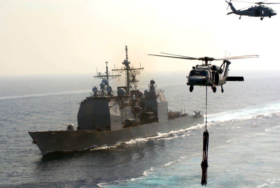US Navy 070414-N-3038W-333 Two MH-60S Seahawks, from the Predators of Helicopter Sea Combat Squadron (HSC) 23, fly near USS Vella Gulf (CG 72) during a replenishment at sea