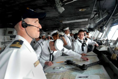 US Navy 070420-N-2959L-071 Assistant Navigator Lt. Joseph Levy looks out the bridge windows of USS Ronald Reagan (CVN 76) while his watch team works to ensure a safe pull in to homeport