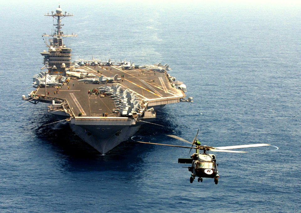 US Navy 070413-N-0684R-251 An SH-60F Seahawk, from the Eightballers of Helicopter Anti-Submarine Squadron (HS) 8, hovers in the air as Nimitz-class aircraft carrier USS John C. Stennis (CVN 74) transits through the Arabian Sea