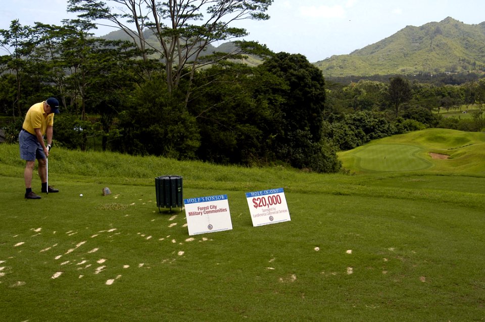 US Navy 070416-N-9076B-012 Fred White tries for a $20,000 hole-in-one during the Forest City Military Communities charity golf tournament to benefit Navy-Marine Corps Relief Society