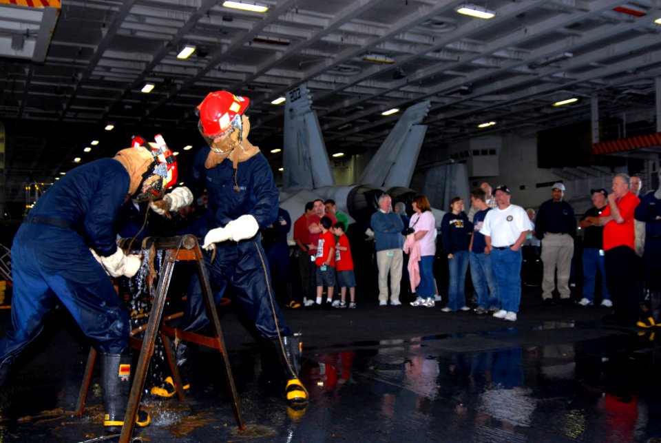 US Navy 070417-N-3659B-165 Members of a repair locker demonstrate pipe-patching techniques to a group of Tigers during tiger general quarters in the hangar bay of USS Ronald Reagan (CVN 76)