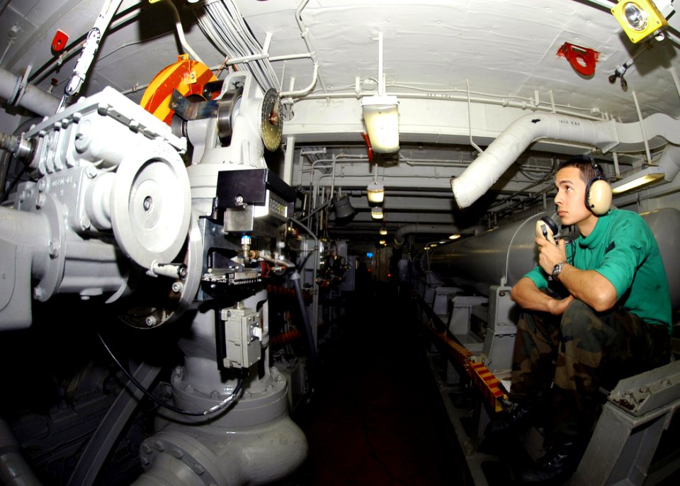 US Navy 070413-N-8446A-001 Aviation Boatswain's Mate Airman Sena Nicholas relays weight readings while manning an arresting gear engine aboard Nimitz-class aircraft carrier USS Dwight D. Eisenhower (CVN 69)