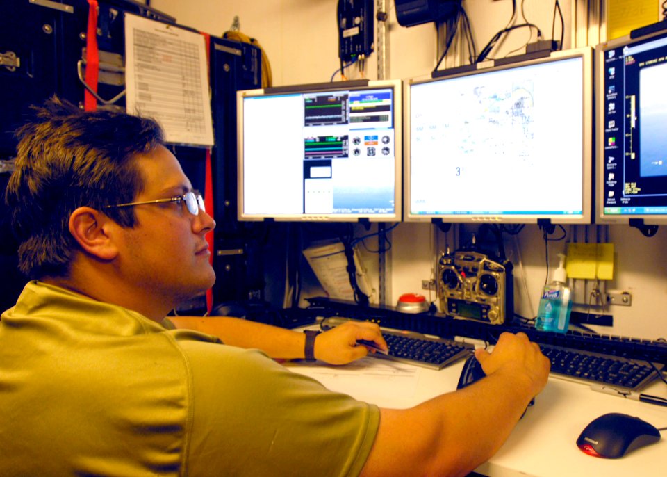 US Navy 070417-N-4790M-110 At the operations station, Matt M. Nation, a field systems representative from Insitu, Inc., controls Unmanned Aerial Vehicle (UAV) Scan Eagle