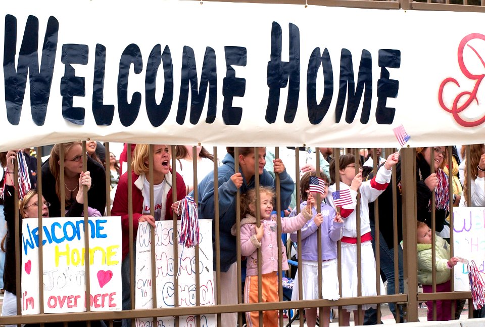 US Navy 070420-N-9712C-004 Families and friends of Sailors embarked on board USS Ronald Reagan (CVN 76) gather on the pier at Naval Air Station North Island to greet the Sailors as the ship returns home from deployment
