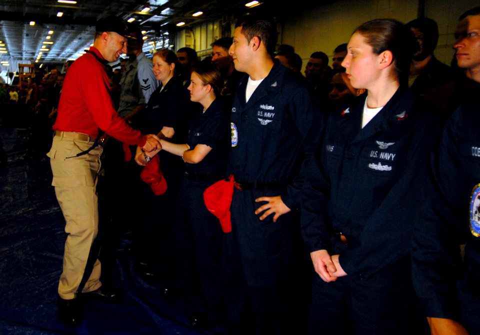 US Navy 070418-N-2659P-064 USS John C. Stennis (CVN74) Commanding Officer, Capt. Bradley Johanson, shakes hands with the crew just after a Captain's Call in the hangar bay