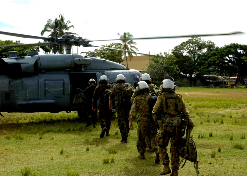 US Navy 070416-N-4790M-023 United States, New Zealand and Australian service members board an SH-60F Seahawk, assigned to Helicopter Anti-Submarine Squadron 10