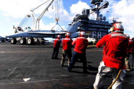 US Navy 070418-N-6326B-028 Flight deck Sailors remove an F-18 training aircraft from the landing area during a crash and recovery drill aboard nuclear-powered aircraft carrier USS Nimitz (CVN 68)