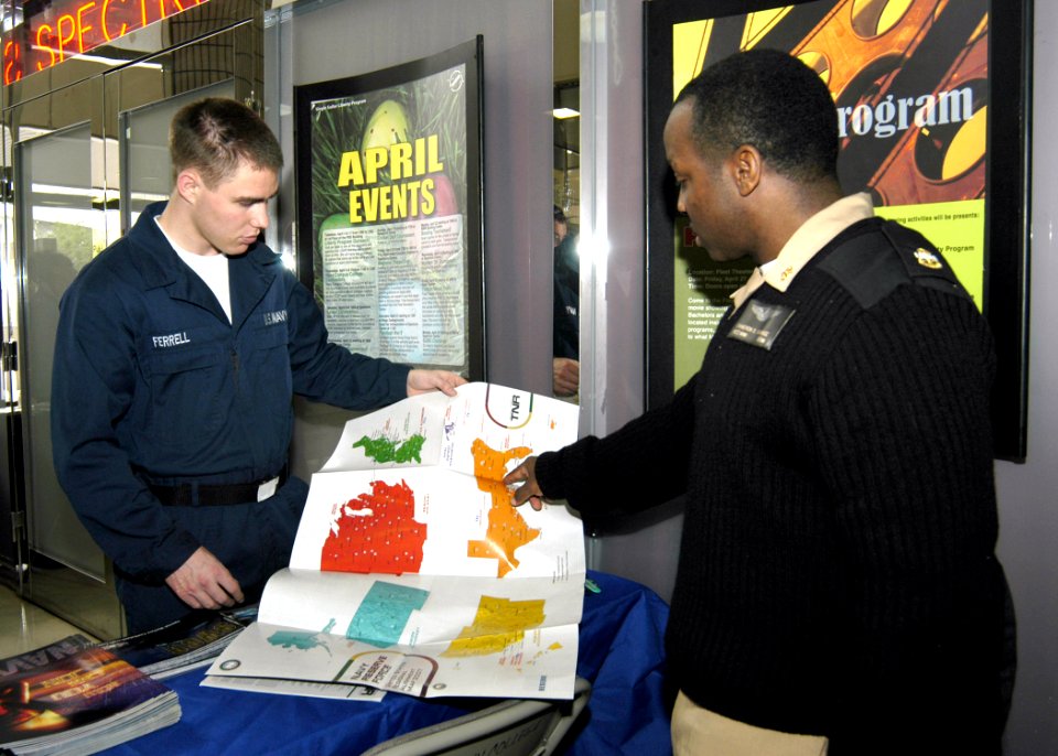 US Navy 070418-N-4649C-049 Chief Navy Counselor Cameron B. Savage points out locations of Navy Reserve Centers in the United States to Airman Tyler Ferrell