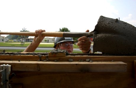 US Navy 070419-N-4198C-159 Builder Constructionman Apprentice Charlie Hughes, a Seabee attached to Naval Mobile Construction Battalion (NMCB) 3 photo