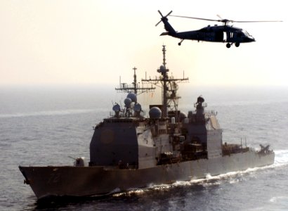 US Navy 070414-N-3038W-540 An MH-60S Seahawk, from the Predators of Helicopter Sea Combat Squadron (HSC) 23, flies near USS Vella Gulf (CG 72)